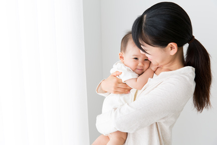 asian baby and mother relaxing